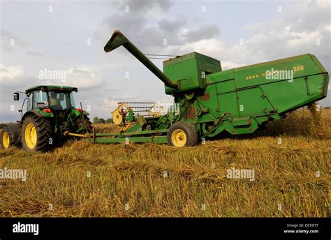 The combine harvester, or simply combine, is a machine that combines the tasks of harvesting. . Tractor pulled combine harvester